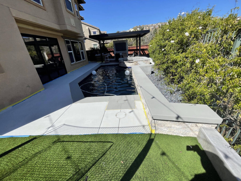 A8B2DCA1-5D4D-4740-BB50-93CEE6B995A2 decorated concrete around pool area